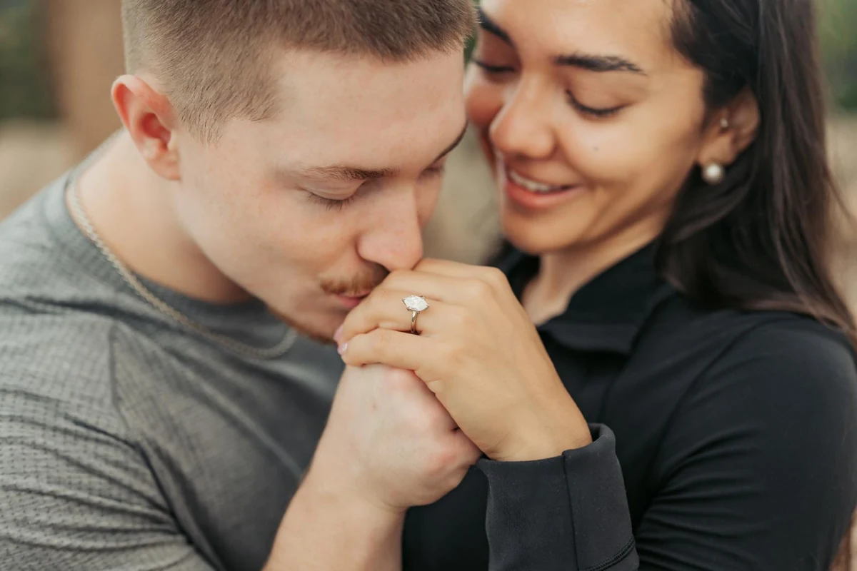 An OVOEU couple with their engagement ring.
